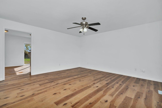 unfurnished room featuring ceiling fan and light wood-type flooring