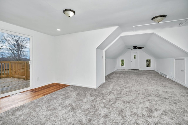 additional living space featuring ceiling fan, light wood-type flooring, and lofted ceiling