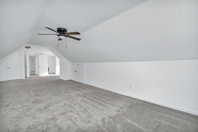 additional living space featuring carpet flooring, ceiling fan, and vaulted ceiling