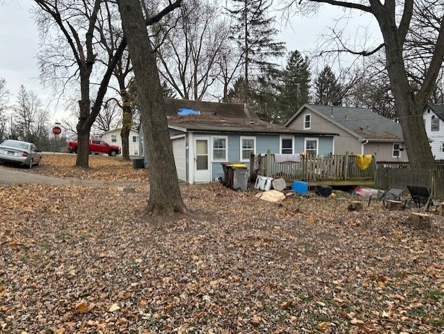 back of property with a wooden deck