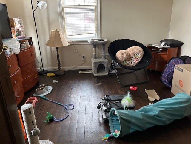 miscellaneous room featuring dark hardwood / wood-style floors