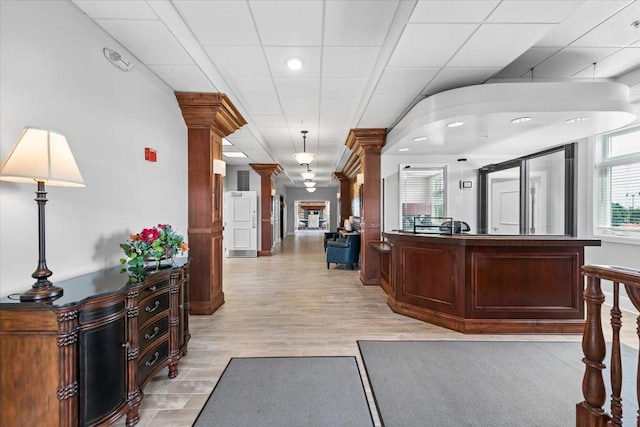 welcome area featuring ornate columns