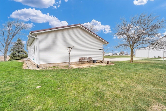 view of property exterior featuring a lawn