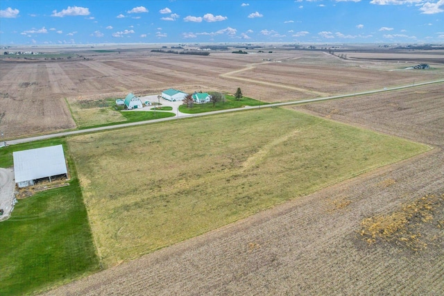 birds eye view of property with a rural view