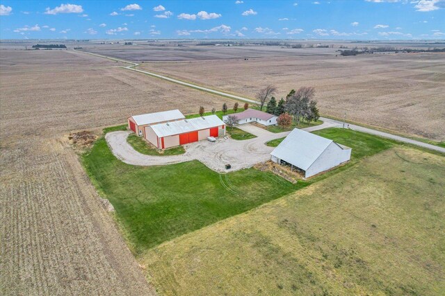 birds eye view of property with a rural view