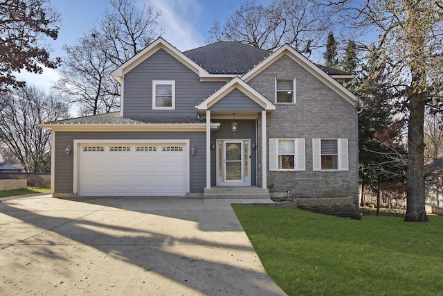 view of front of property featuring a garage and a front lawn