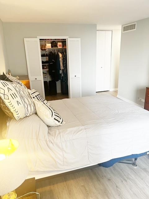 bedroom featuring hardwood / wood-style flooring