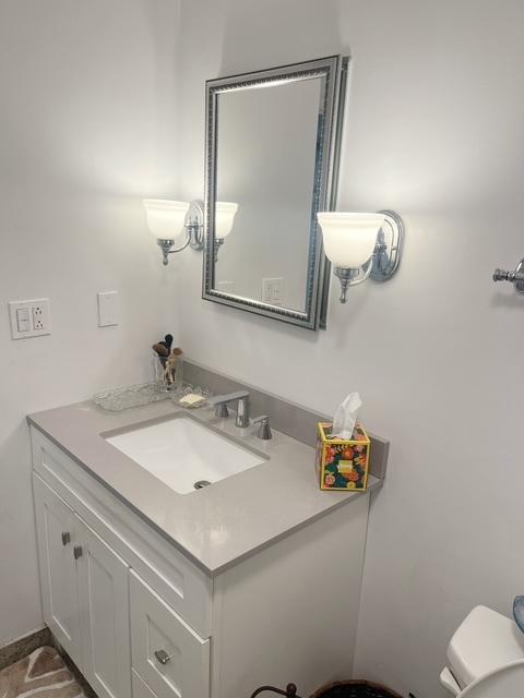 bathroom with vanity and toilet