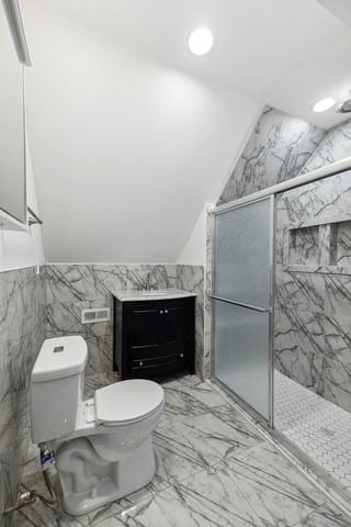 bathroom with walk in shower, vaulted ceiling, tile walls, and toilet