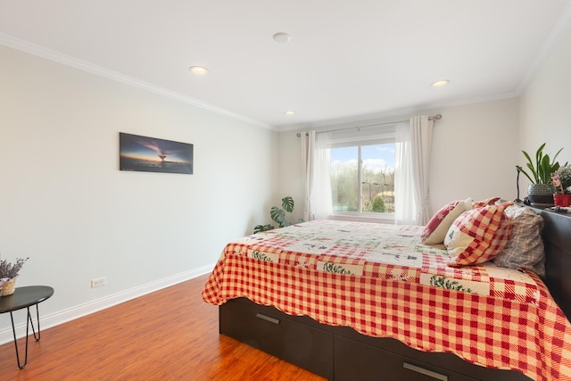 bedroom featuring wood-type flooring and crown molding