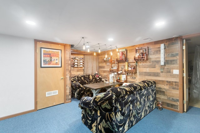 bar featuring carpet floors and wooden walls