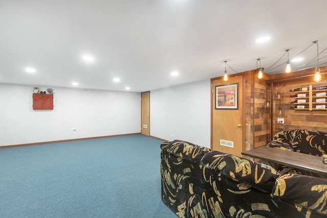 interior space featuring carpet and wood walls