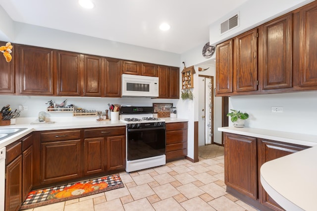 kitchen with white appliances and sink