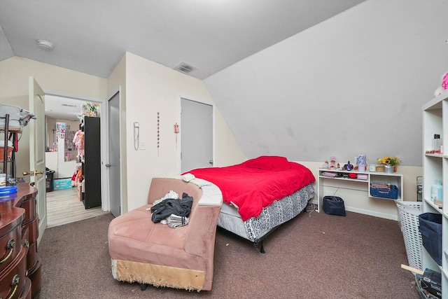 carpeted bedroom featuring vaulted ceiling