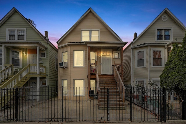 bungalow-style house featuring central AC unit and a porch