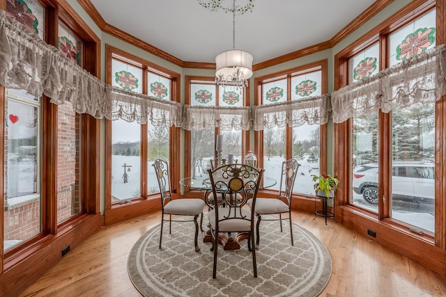 sunroom with an inviting chandelier