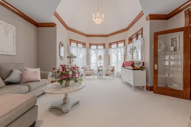 carpeted living room with an inviting chandelier and ornamental molding