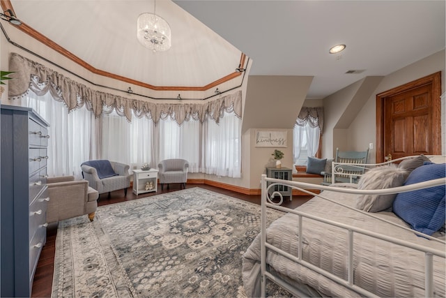 bedroom featuring a notable chandelier, wood-type flooring, and multiple windows