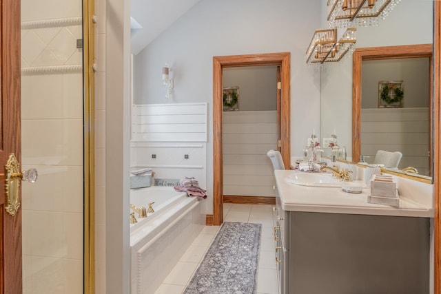 bathroom with tile patterned flooring, vanity, plus walk in shower, and lofted ceiling