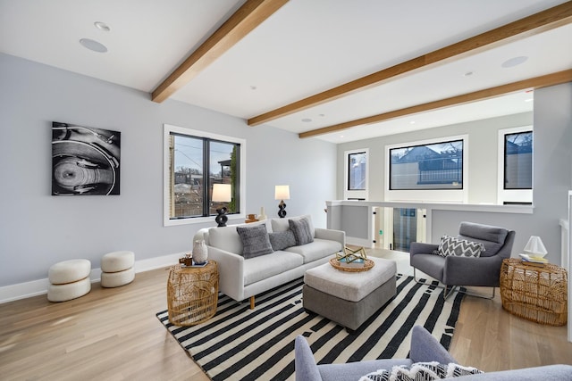 living room with recessed lighting, baseboards, beam ceiling, and wood finished floors