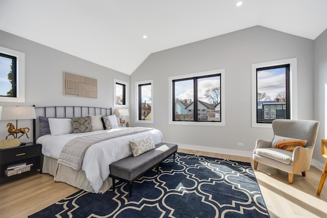 bedroom with vaulted ceiling, light wood-style flooring, recessed lighting, and baseboards