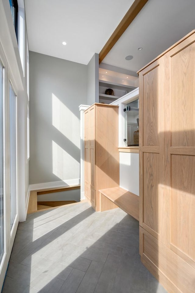 bathroom with recessed lighting and beamed ceiling