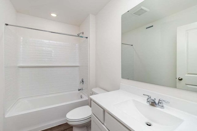 full bathroom featuring wood-type flooring, vanity, shower / bath combination, and toilet