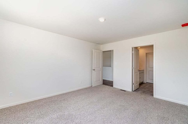 unfurnished bedroom featuring light colored carpet