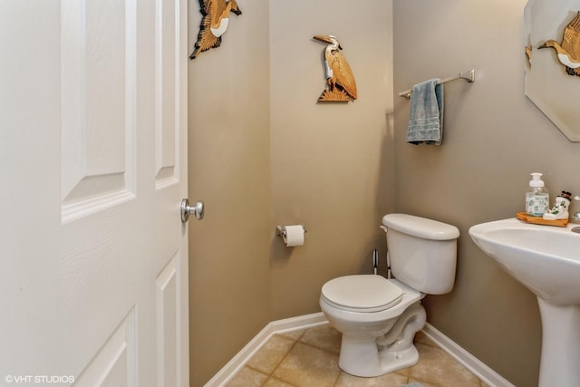 bathroom featuring tile patterned floors and toilet