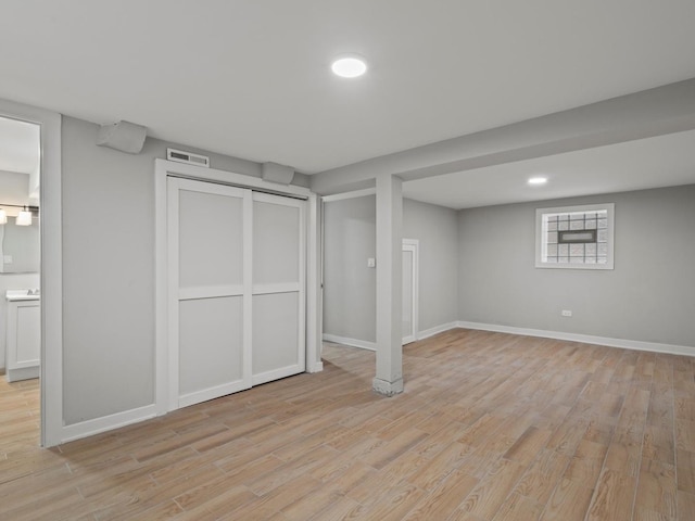 basement with light wood-type flooring