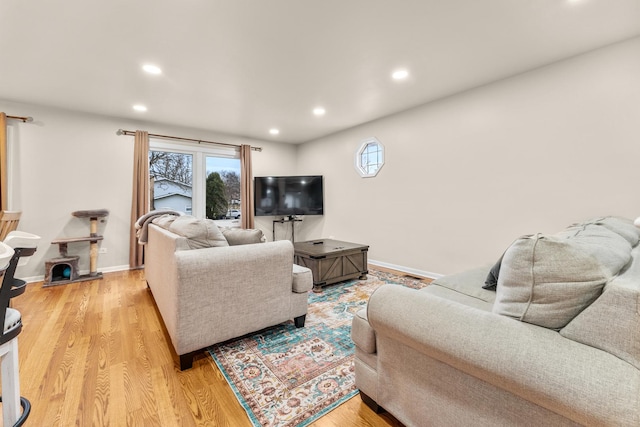 living room with light hardwood / wood-style flooring