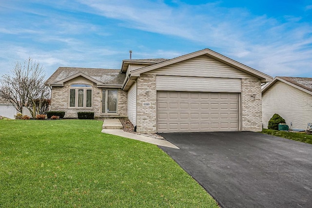 ranch-style house with a garage and a front lawn