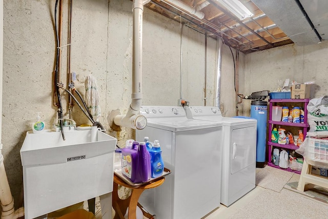 laundry room featuring separate washer and dryer and sink