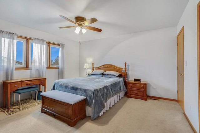 bedroom with light carpet and ceiling fan