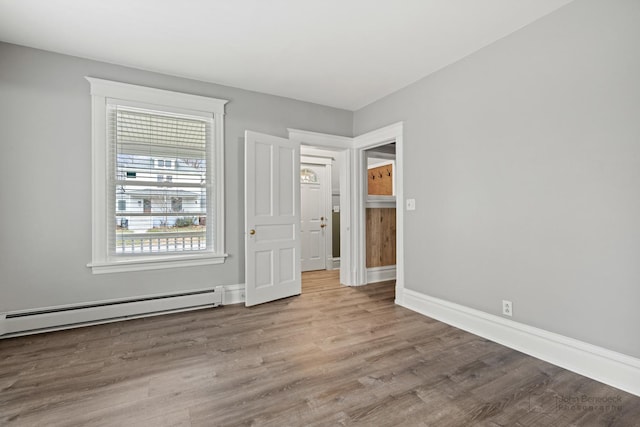 interior space with light hardwood / wood-style flooring and a baseboard radiator