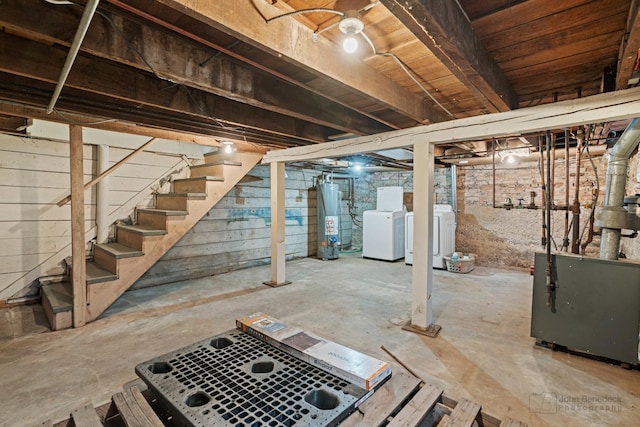 basement featuring separate washer and dryer and water heater