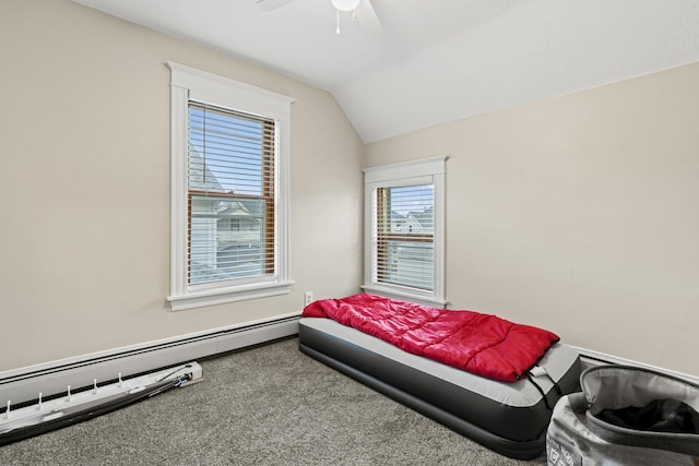 carpeted bedroom featuring a baseboard radiator, vaulted ceiling, and ceiling fan