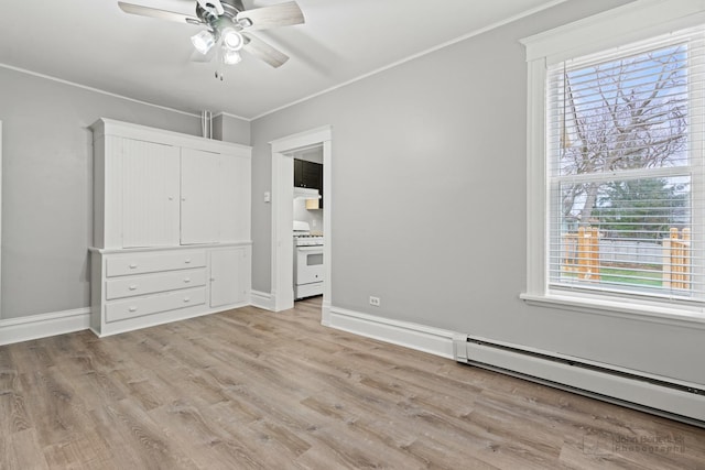 unfurnished bedroom featuring ceiling fan, light hardwood / wood-style flooring, a baseboard radiator, and ornamental molding