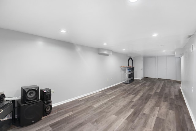 basement with hardwood / wood-style floors