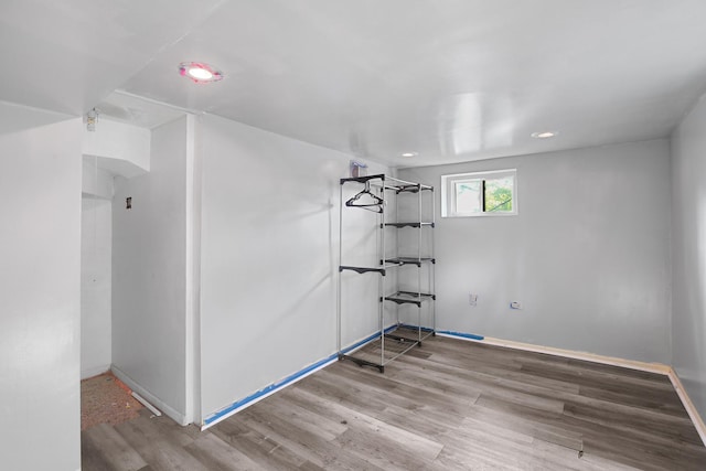 unfurnished room featuring hardwood / wood-style flooring