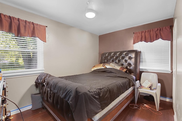 bedroom featuring dark hardwood / wood-style flooring