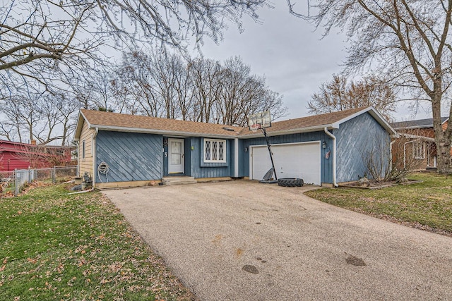 ranch-style house with a front lawn and a garage