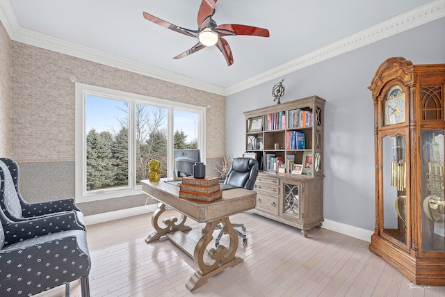 office space with crown molding, ceiling fan, and light hardwood / wood-style floors