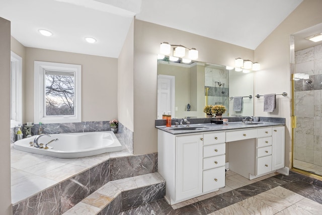 bathroom featuring plus walk in shower, vanity, and lofted ceiling