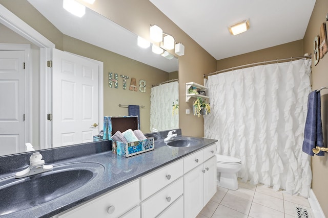 full bath featuring toilet, tile patterned floors, a sink, and double vanity