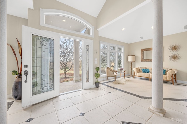 tiled foyer featuring ornate columns