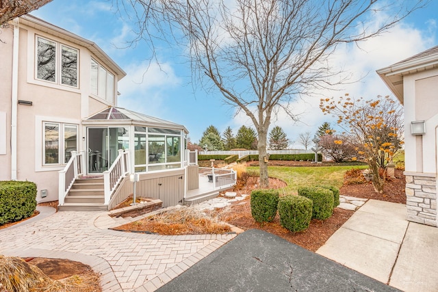 view of yard with a sunroom