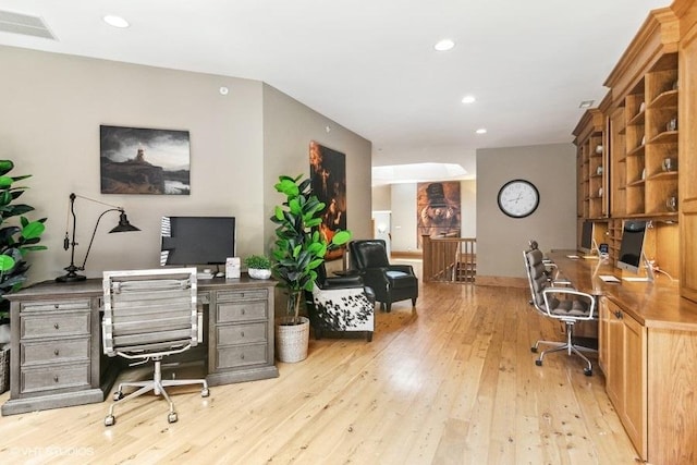 office area with light hardwood / wood-style flooring and built in desk