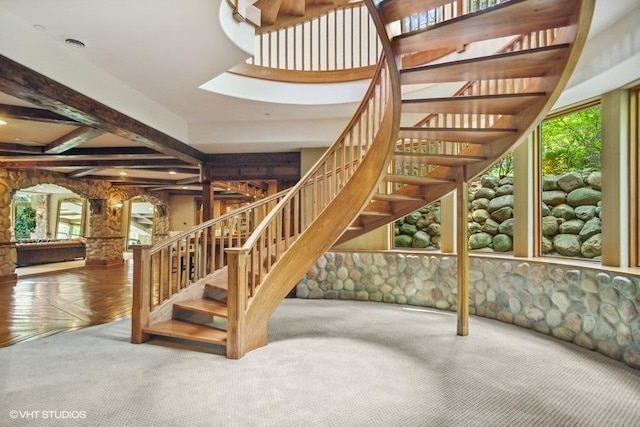 staircase featuring a wealth of natural light