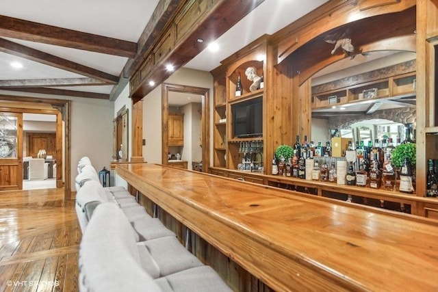 bar with beam ceiling and parquet floors